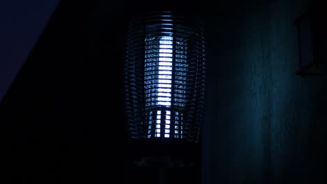 Bug-Zapper-at-Night-Electrocuting-Insects-Wide-Shot