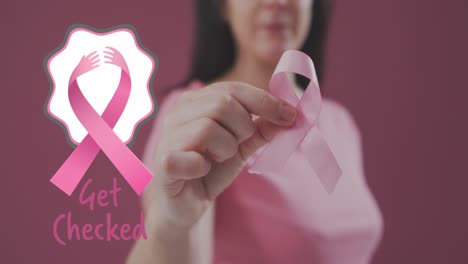 Get-checked-text-banner-with-pink-ribbon-icon-against-mid-section-of-woman-holding-a-pink-ribbon