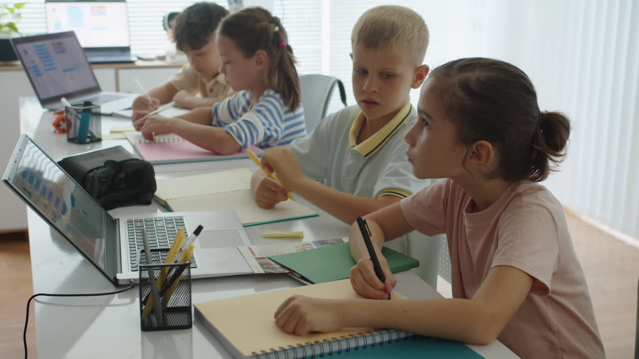 Schoolchildren Doing Test during Programming Class
