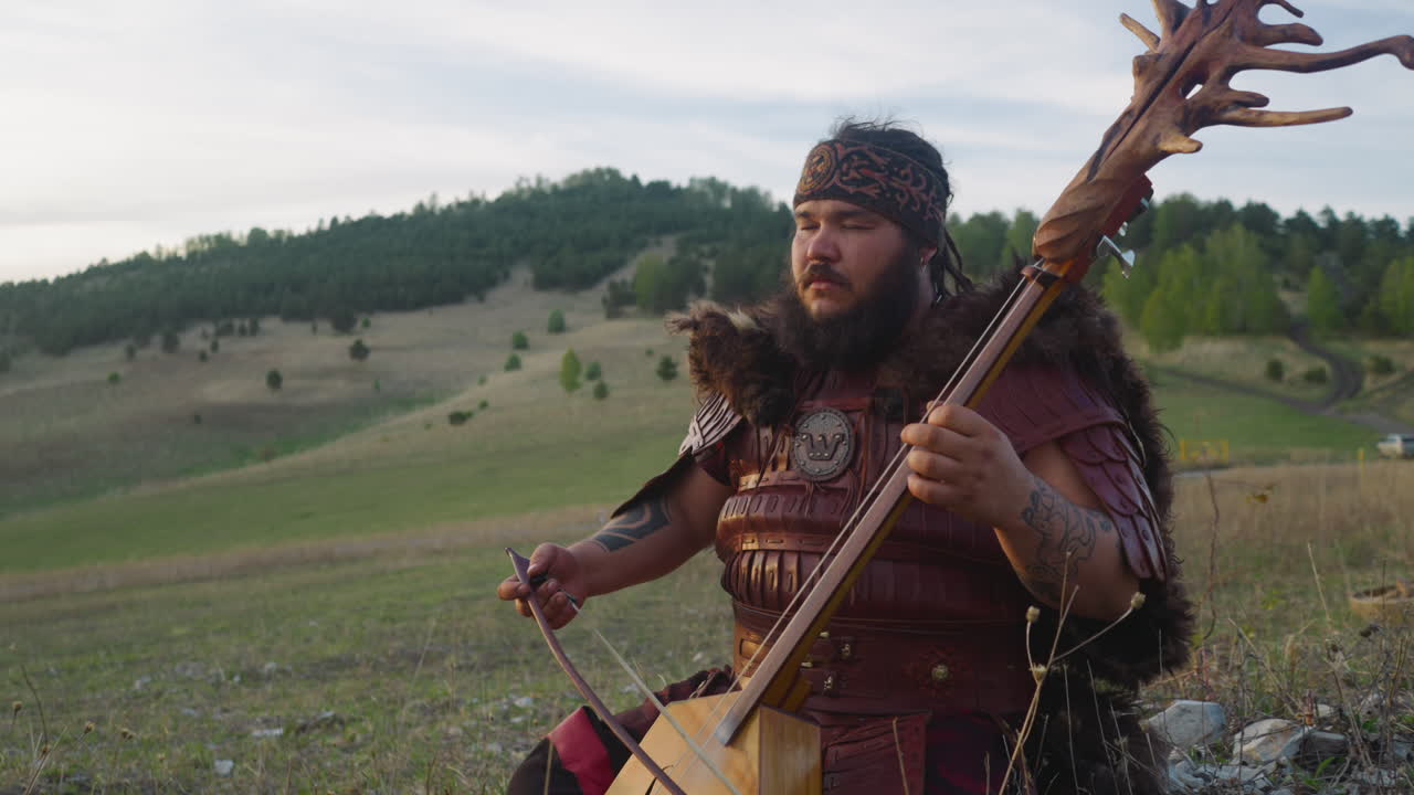 Premium stock video Calm altai music player ikili stringed instrument