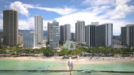 Waikiki-beach-and-high-rises-at-sunset,-Honolulu,-Hawaii