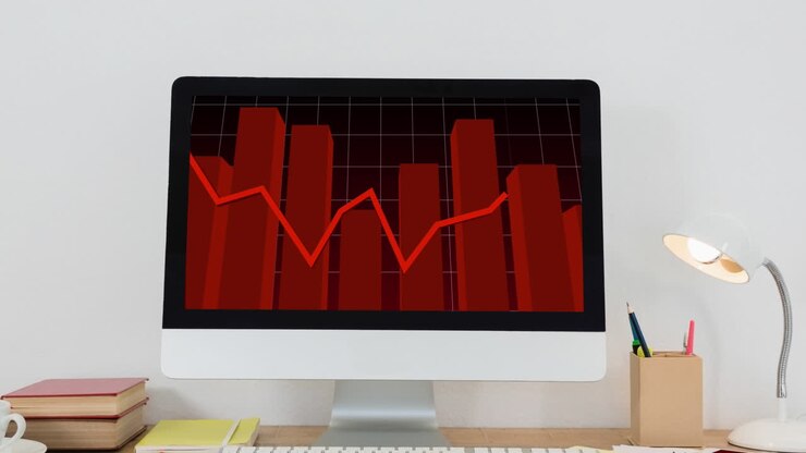 Animation of financial data processing with red line over computer screen on desk