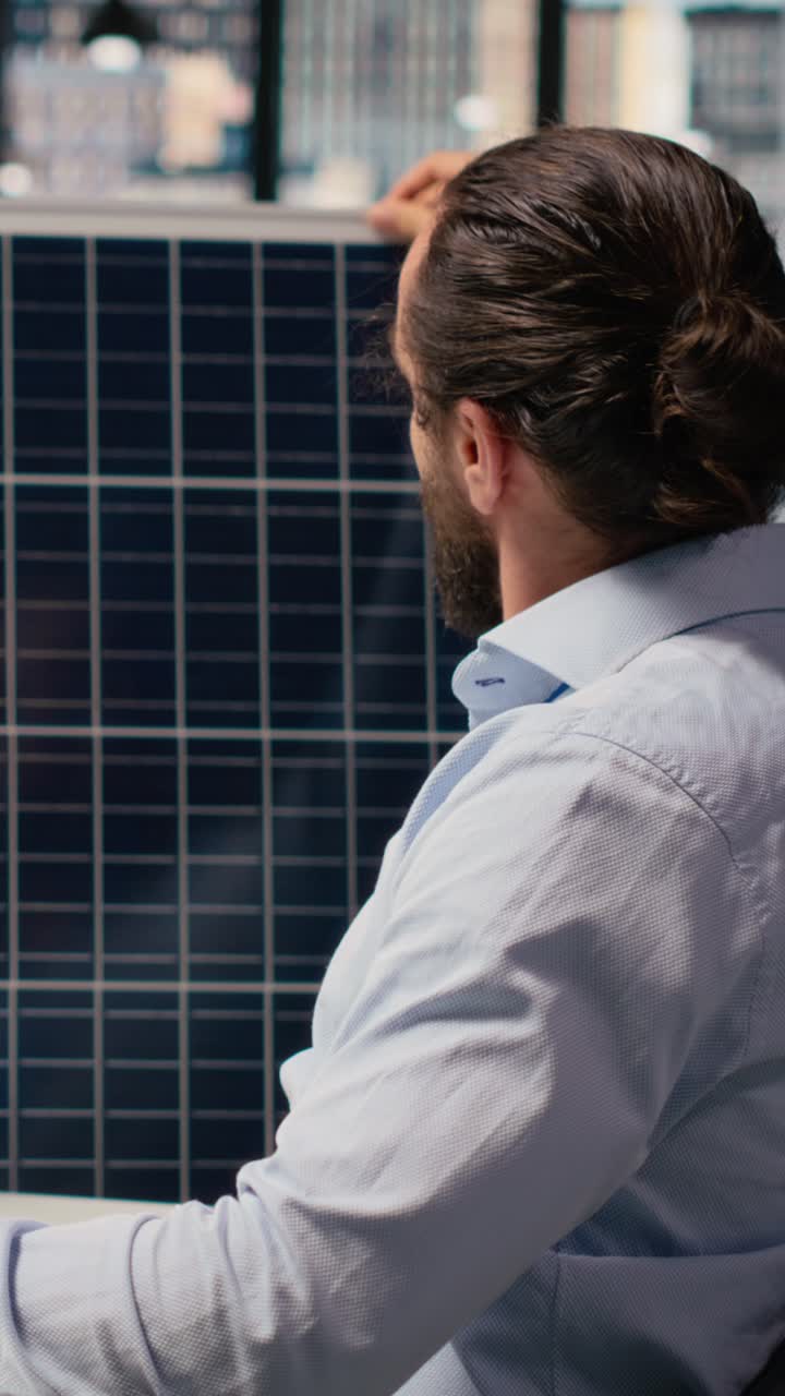 Sustainability RD expert uses CAD program on PC to design solar panels