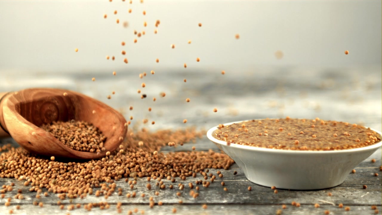 Mustard Seeds Falling in Slow Motion with a Bowl of Mustard