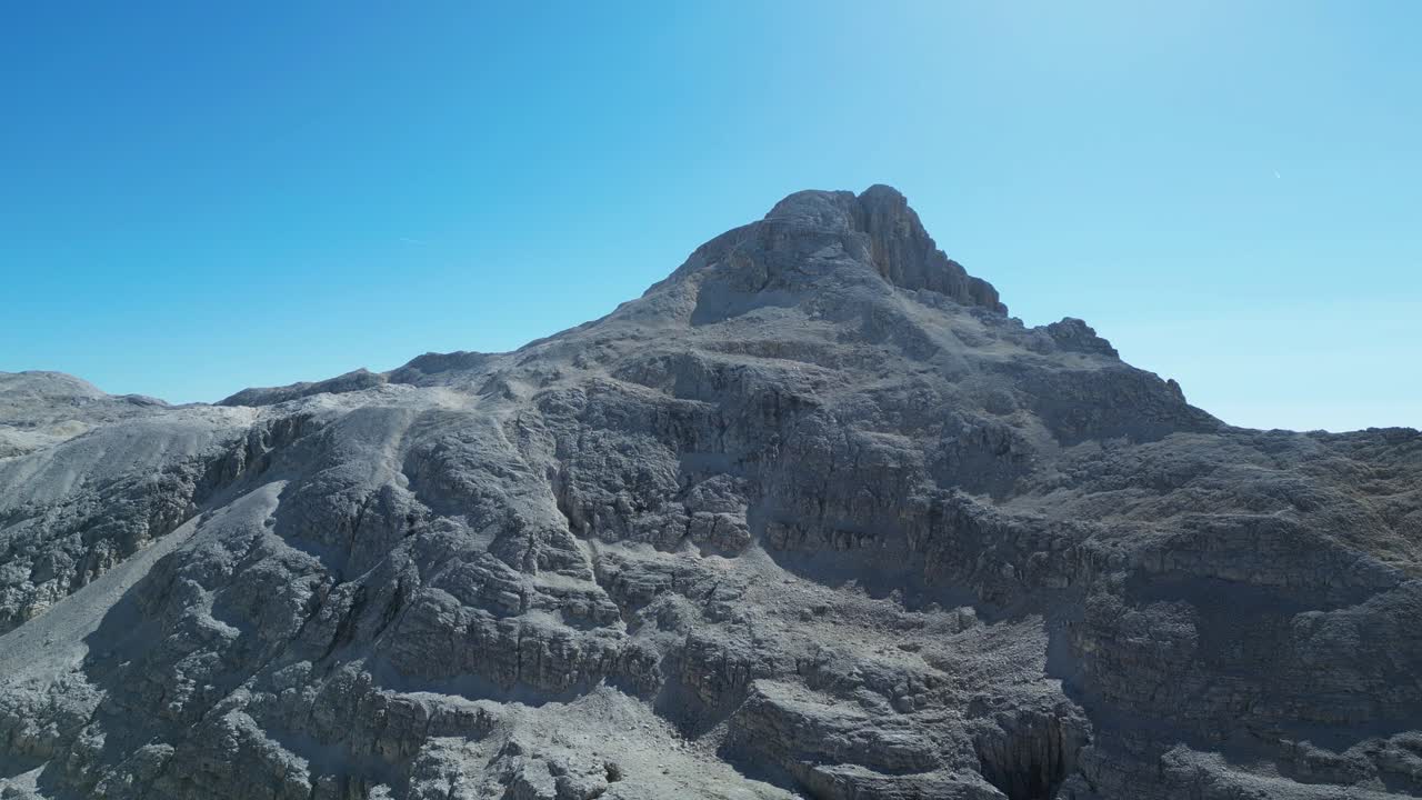 Drone footage of the Pale di San Martino in the Dolomites, Italy: majestic peaks, rocky spires, alpine meadows, and dramatic landscapes ideal for travel, nature, and adventure projects