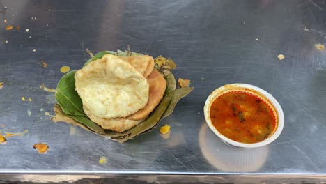 hing kochuri and potato sabji sold in indian street in morning time