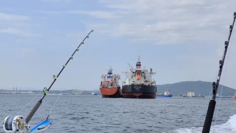 Hand-held-shot-of-large-freight-ships-sailing-through-the-estrecho-de-Gibraltar