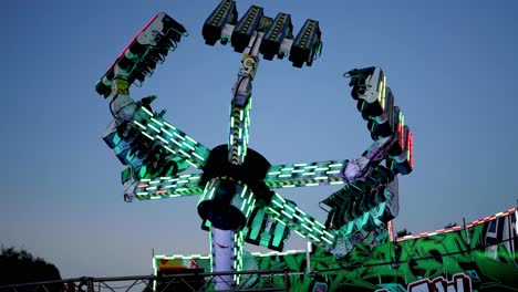 amusement park ride spinning against sky