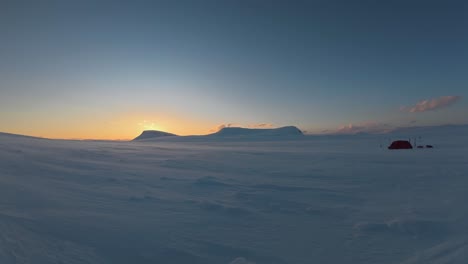 snow drifts at midnight sunset in northern winter snow camp timelapse