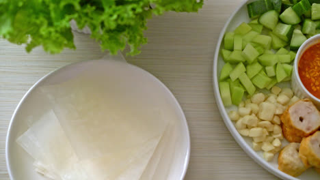 vietnamese pork  meatball with vegetables wraps (nam-neaung or nham due) - vietnamese traditional food culture