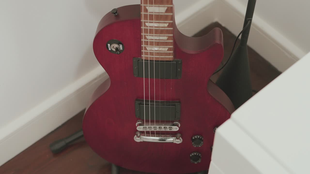 Classic red electric guitar shines with timeless rock appeal