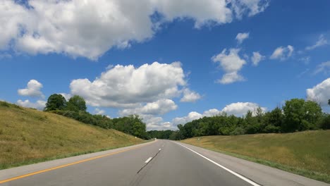 driving on a beautiful highway bordered by greenery of all kinds in the united states