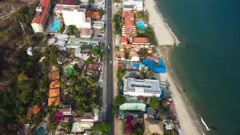 aerial flying over ham tien coast, geotubes on beach, vietnam