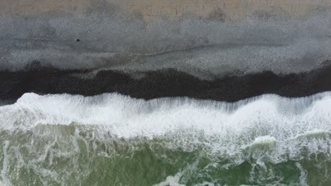 drone 4k footage of a rocky beach in lima, peru