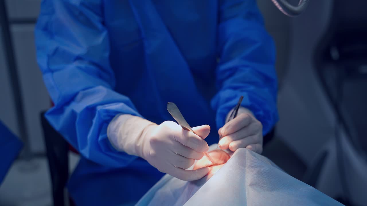 Endoscopic eye surgery. Surgeons holding medical instruments in hands and looking at patient