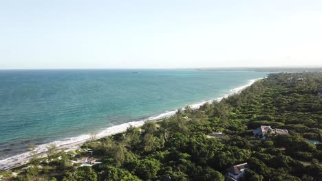 Birds-eye-view-of-beautiful-tropical-coastal-scenery,-seascape-of-long-beach-and-green-rainforest