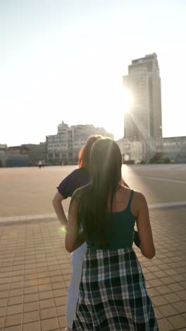 young women on a city rooftop