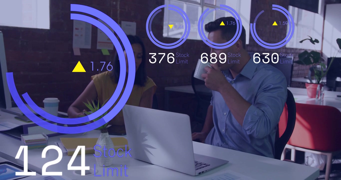 Colleagues sitting, live feed initiating overlays on laptop, readouts guiding business decisions