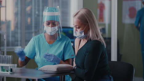 medical professional administering an injection to a patient