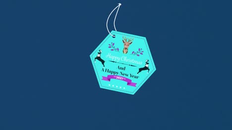 animation of christmas logo with christmas text over blue background