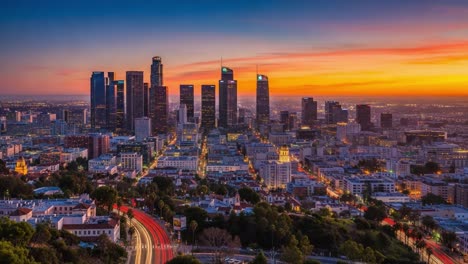 city skyline at dusk with traffic light trails