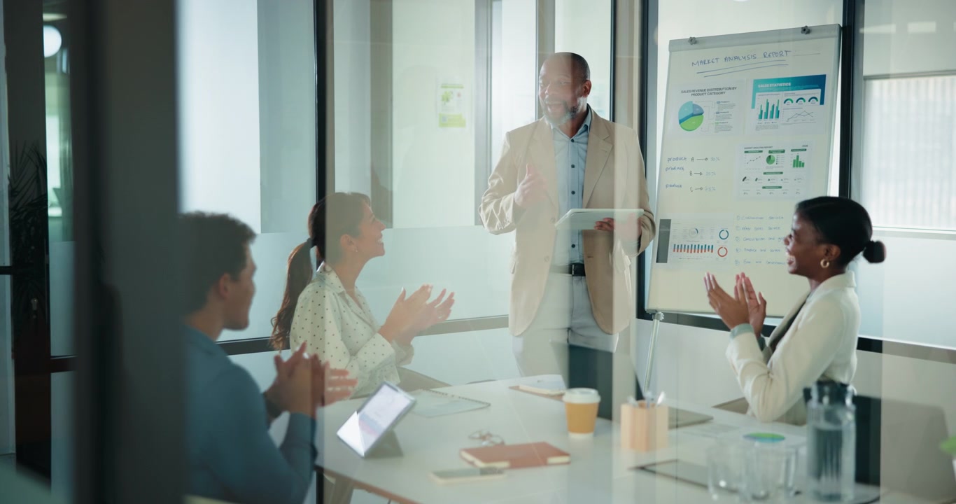 Business Team Applauding During Presentation in Modern Office