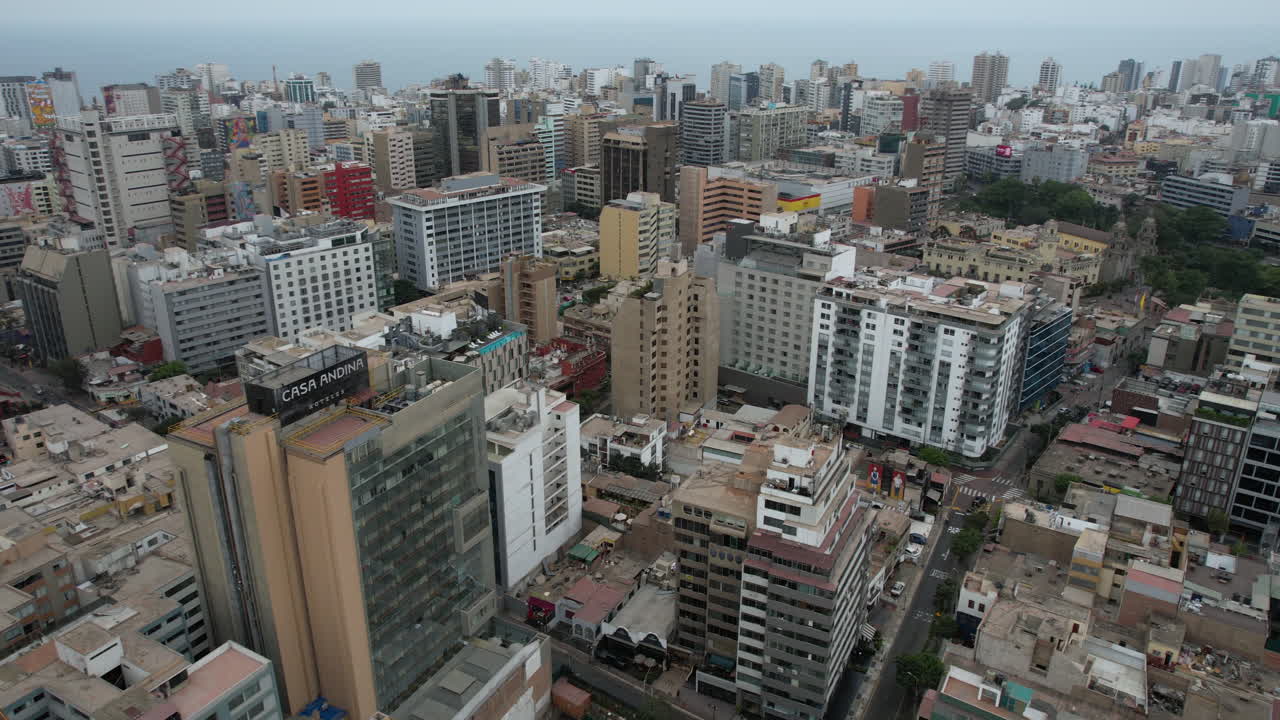 Aerial View of a Dense Coastal City Skyline with Numerous Buildings