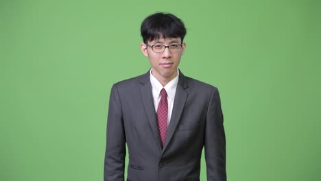 young asian businessman with stop gesture