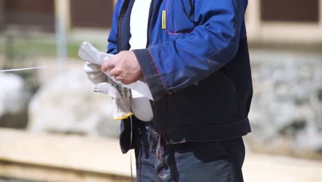 construction worker measuring a site