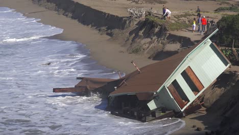 a house along the malibu coastline collapses into the sea after a major storm surge 3