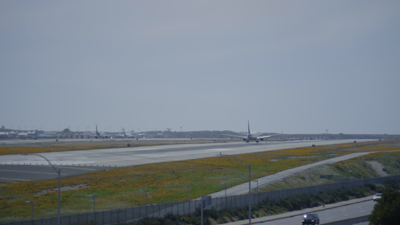 International Airport Airfield. Aircraft landing on runway, airplane taking off. Airport traffic. Commercial jet airliners