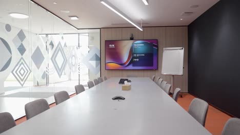 slow establishing shot of a large empty conference table ready for a meeting