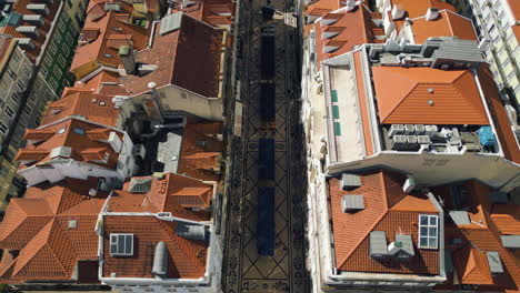 Aerial-view-flying-along-the-Rua-Augusta-street-in-Lisbon,-sunny-day-in-Portugal