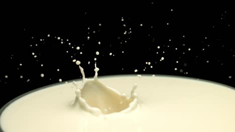 slow motion of fresh strawberry falling into milk making splash,1000fps