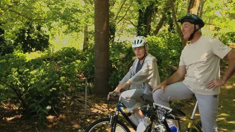 old woman and man on bikes looking of their way