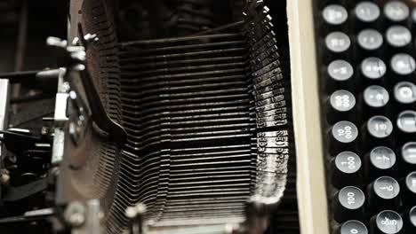 Typebars-Of-A-Vintage-Manual-Typewriter-During-Typing-Operation