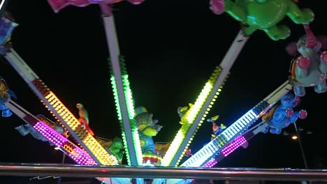 a children's ride at a amusement fair at night