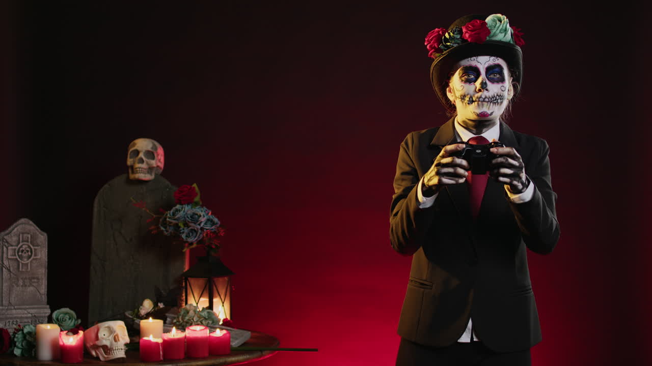 A woman dressed in a Day of the Dead costume playing video games