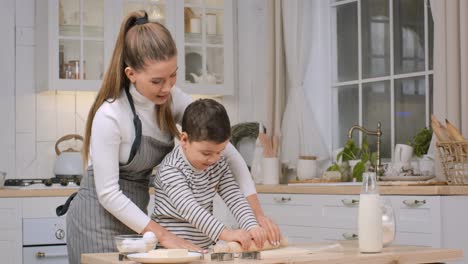 mother and son baking cookies together