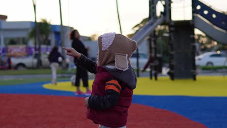 boy with cute sheepskin hat on a cold day