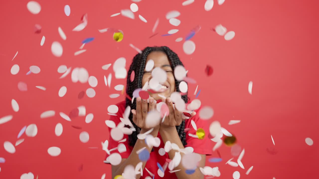 Woman throwing confetti in celebration