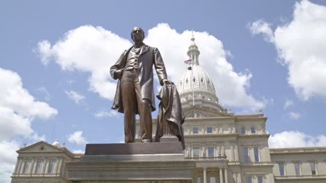statue of austin blair in front of the michigan state capitol building
