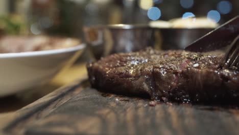 slicing a perfectly cooked steak