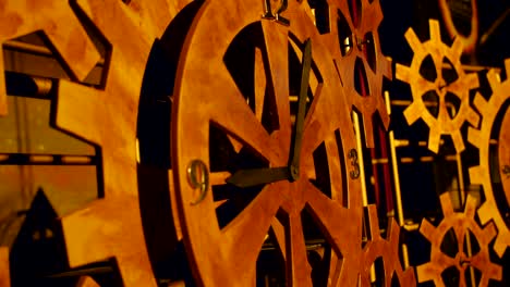 huge wooden gears. increased clock mechanism. a rotating gear.