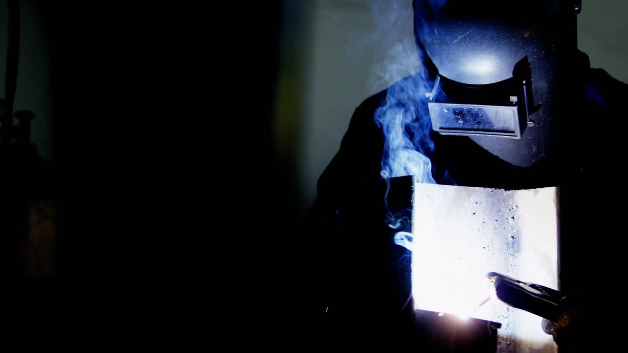 Welder welding a metal