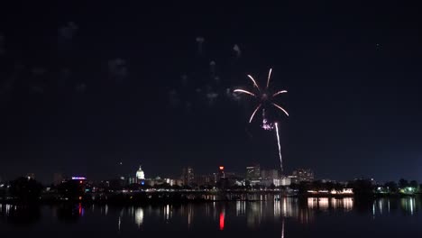 harrisburg, pennsylvania - july 4, 2022: fireworks over the capital city of harrisburg, pennsylvania from across the susquehanna river grand finale