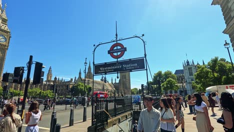 people entering and exiting westminster underground station