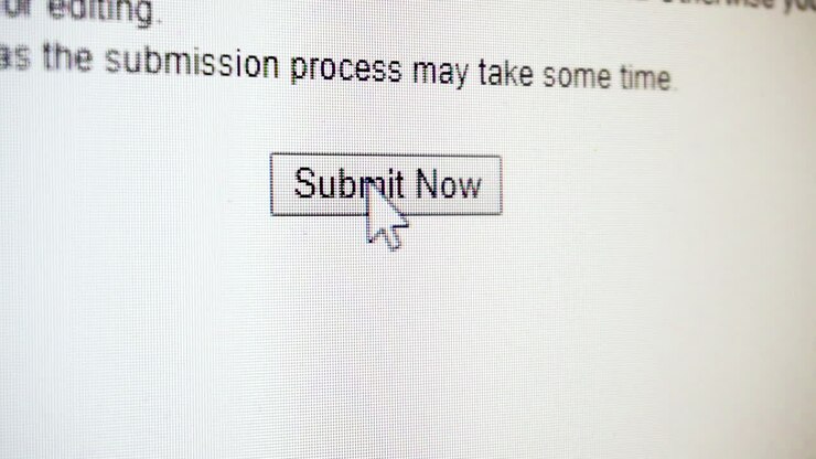Close up of clicking 'submit now' button on computer screen