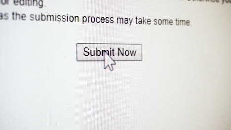 Close-up-of-clicking-'submit-now'-button-on-computer-screen