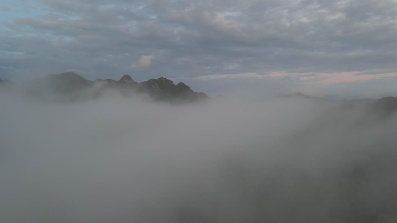 drone fly close up in the clouds mountain background